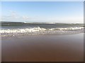 NZ2896 : Waves hitting the beach, Druridge Bay by Graham Robson