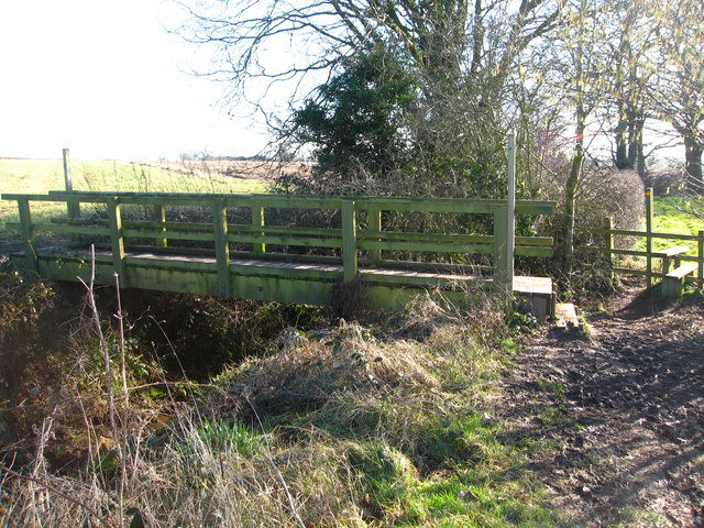 Sturdy footbridge over a deep drainage ditch