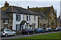 Houses and former chapel beside the green at St Helens