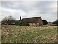 Derelict building in field by A34