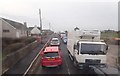 Slow moving traffic on the western outskirts of the village of Ballymartin