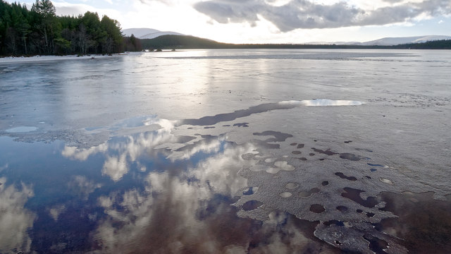 Ice and clouds in the surface of Loch Morlich