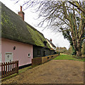 Kneesworth: plaster, weatherboarding and mossy thatch