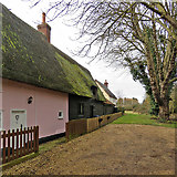 TL3444 : Kneesworth: plaster, weatherboarding and mossy thatch by John Sutton