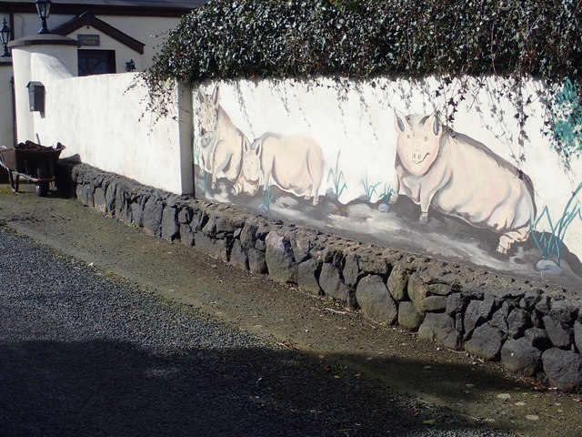 Porcine mural on the garden wall of Legmore House
