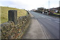 Guide post on top of Long Lee Lane wall