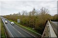 The A39 heading west towards Roundswell and passing Larkbear Plantation on the right