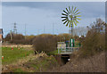 A windmill helping with the drainage