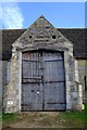SO8125 : Ashleworth tithe barn door by John Winder
