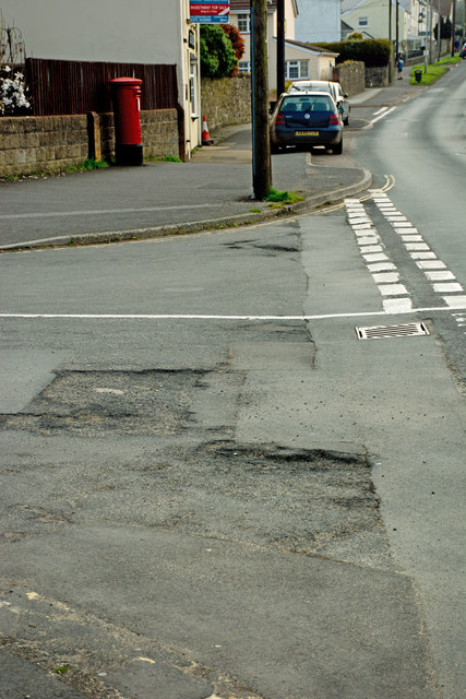 A structural failure in the road surface at the junction of  B3233 with Babbages