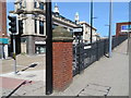 SJ8990 : Brick pillar and fence between Chestergate and Mersey Square by John S Turner