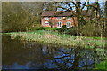 Pond and house at Lasham