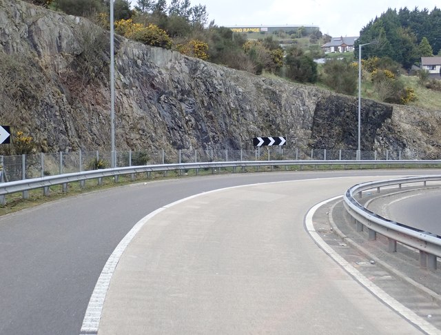 Cutting through igneous rocks created for the A2 exit road from the A1