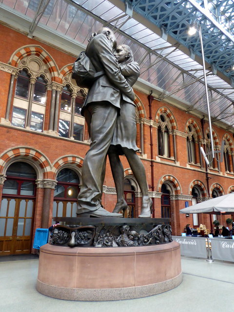 Bronze statue of lovers embracing at St Pancras station