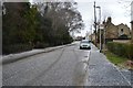 Hailstones cover the road