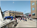 Tourists and others at the south end of London Bridge