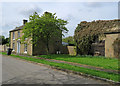 Stuntney: a plain brick house and an overgrown barn