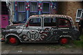 View of the "Voodoo Zulu Liberation Taxi" in front of The Treatment Rooms on Fairlawn Grove