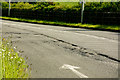 A structural failure in the road surface on the B3233 near the junction with Manteo Way