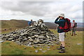 SJ0734 : Walkers by cairn on summit of Cadair Bronwen by Roger Davies