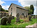 Gravestones and a former chapel in the north of Pengenffordd, Powys