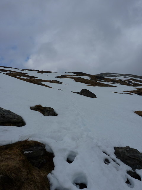 Snow-covered path climbing into Coire Reidh