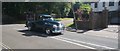 View of a 1952 Chevrolet pick-up truck passing along Court Road