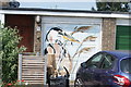 View of a street art heron on the door of a garage on Waterside, off Coppermill Lane