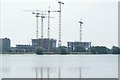 View of cranes reflected in the High Maynard Reservoir in the Walthamstow Wetlands