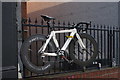 View of an exercise bike advertising the Flex Gym and Fitness Club on the railings on St. James Street