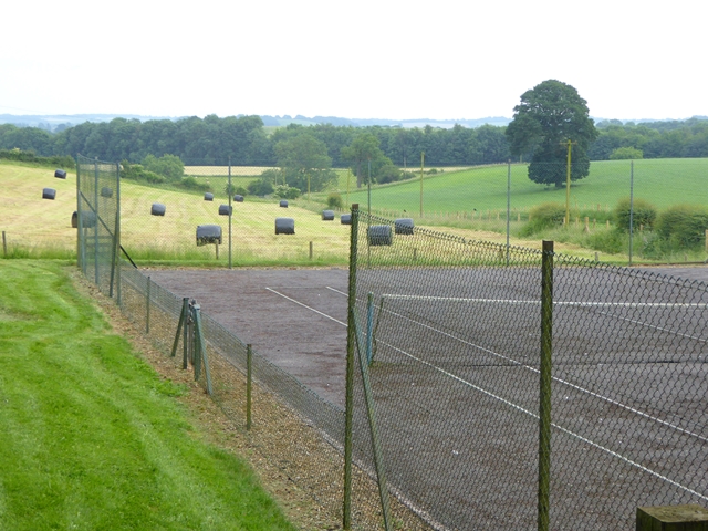 Tennis court and hay bales