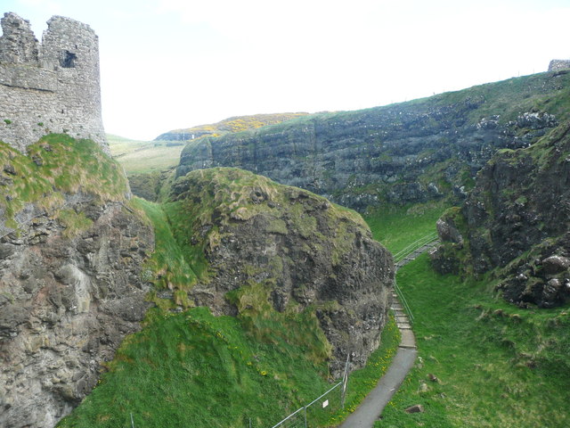 The defensive ditch on the south side of Dunluce Castle
