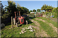 Old tractor at exit to field