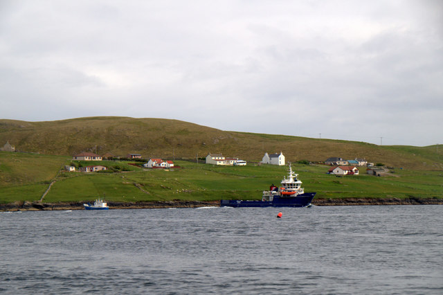 MV Filla passing Marrister, Whalsay