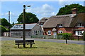 Thatched cottage beside triangular green