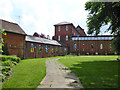 Corner of churchyard and old factory buildings, Haverhill