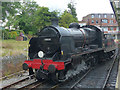 Steam locomotive on a run around at Swanage Station