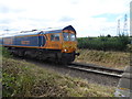 A freight train approaches Wybourne Crossing