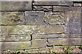 Benchmark on wall of track off Burnley Road