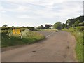 NU0302 : Road junction north of Thropton by Graham Robson