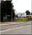 Henllys Way bus stop and shelter near a direction sign, Cwmbran