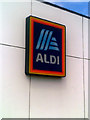 TM5394 : Aldi sign on the wall at Aldi Superstore, Oulton Broad by Geographer