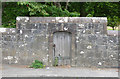 A gate in the wall beside Irvine Road