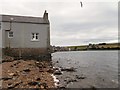 House with its feet in the sea