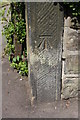 Benchmark on post at Rochdale Road wall angle