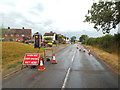 SP7684 : Temporary traffic lights on Harborough Road, Braybrooke by Malc McDonald