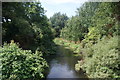 View along the River Wandle towards Wimbledon from the bridge leading to Sainsbury