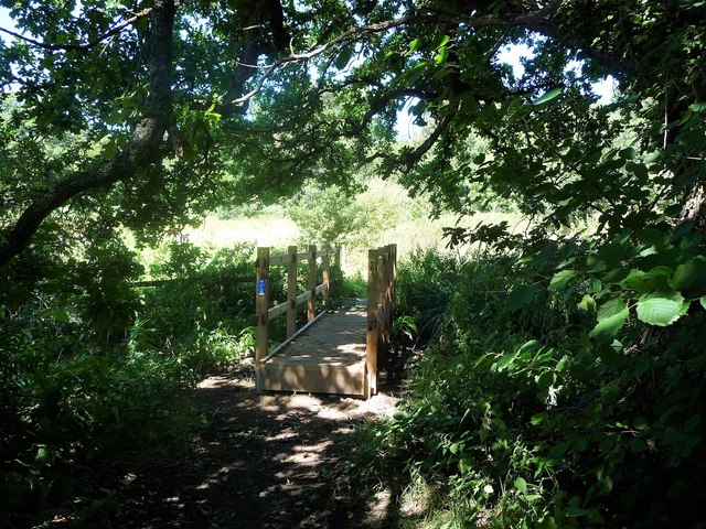 Waymarked footbridge over a drain, near Ramslye Farm