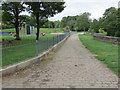 Cobbled pathway and play area in Ball Grove Park