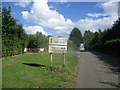 Y fynedfa i faes carafanau Blossoms / The entrance to Blossoms Caravan Park